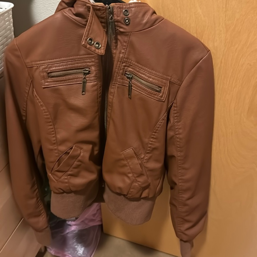 Brown fake leather jacket with white fur worn twice and grow out of it y